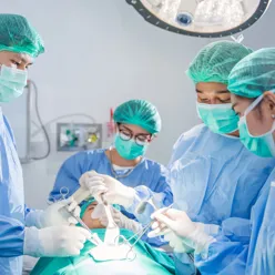 A group of surgeons performing surgery