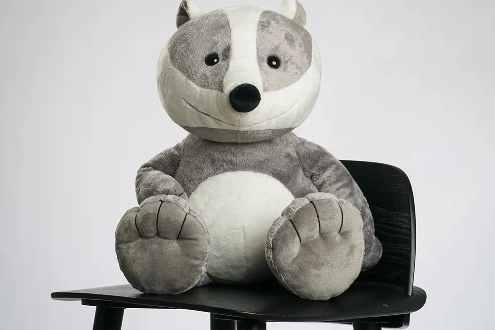 A stuffed bear on a chair